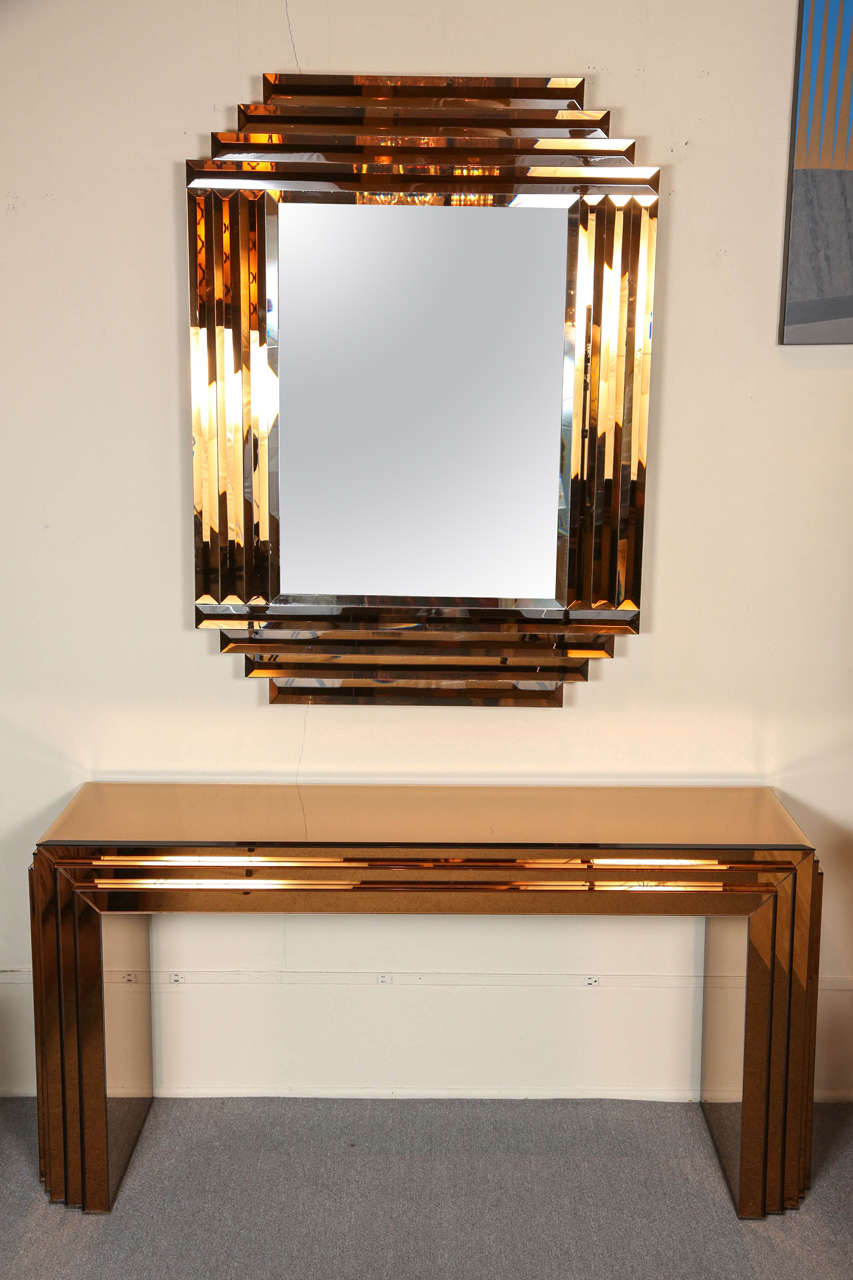 Glamorous faceted mirror and console.
The copper toned mirror reflect and give a stunning shimmering effect.
There are a couple of minimal scratches to the top surface of the console which do not detract from the beauty of this set.
Mirror