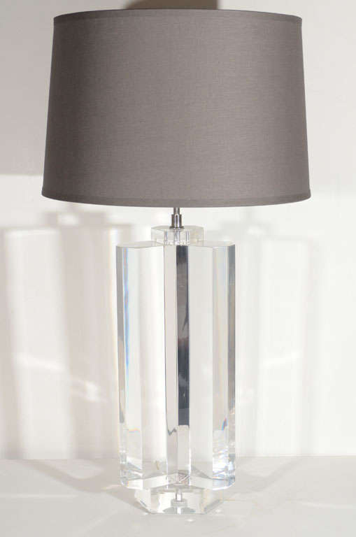 Modernist dense solid  lucite lamp with 
stylized trefoil design in the manner of
Karl Springer.  Lamp has chrome fittings
and a chrome finial, and is fitted with two 
lights as well as chain pulls. Shown with 
large charcoal linen drum shade. 