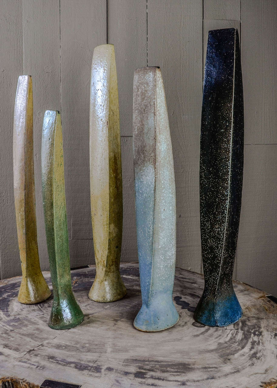 Salt-glazed stoneware cycladic figures by the danish artist. Size between 49-66cm high.
The shape of these sculptures was inspired by the cycladic statues. Nice palette of  5 colors with different glaze finish. Sometimes it is very matt and