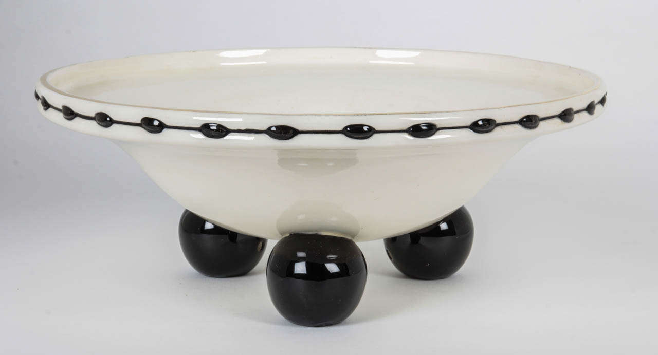 Julius Dressler Biela (1888-1945) Czech Republic.
     

Bowl 1910.

Black and white glazed earthenware with three ball feet .

Marks: JDB, 7764 (underglaze).

Measures: H: 4 7/8” x D base: 10 7/8”

Julius Dressler was a noted Bohemian