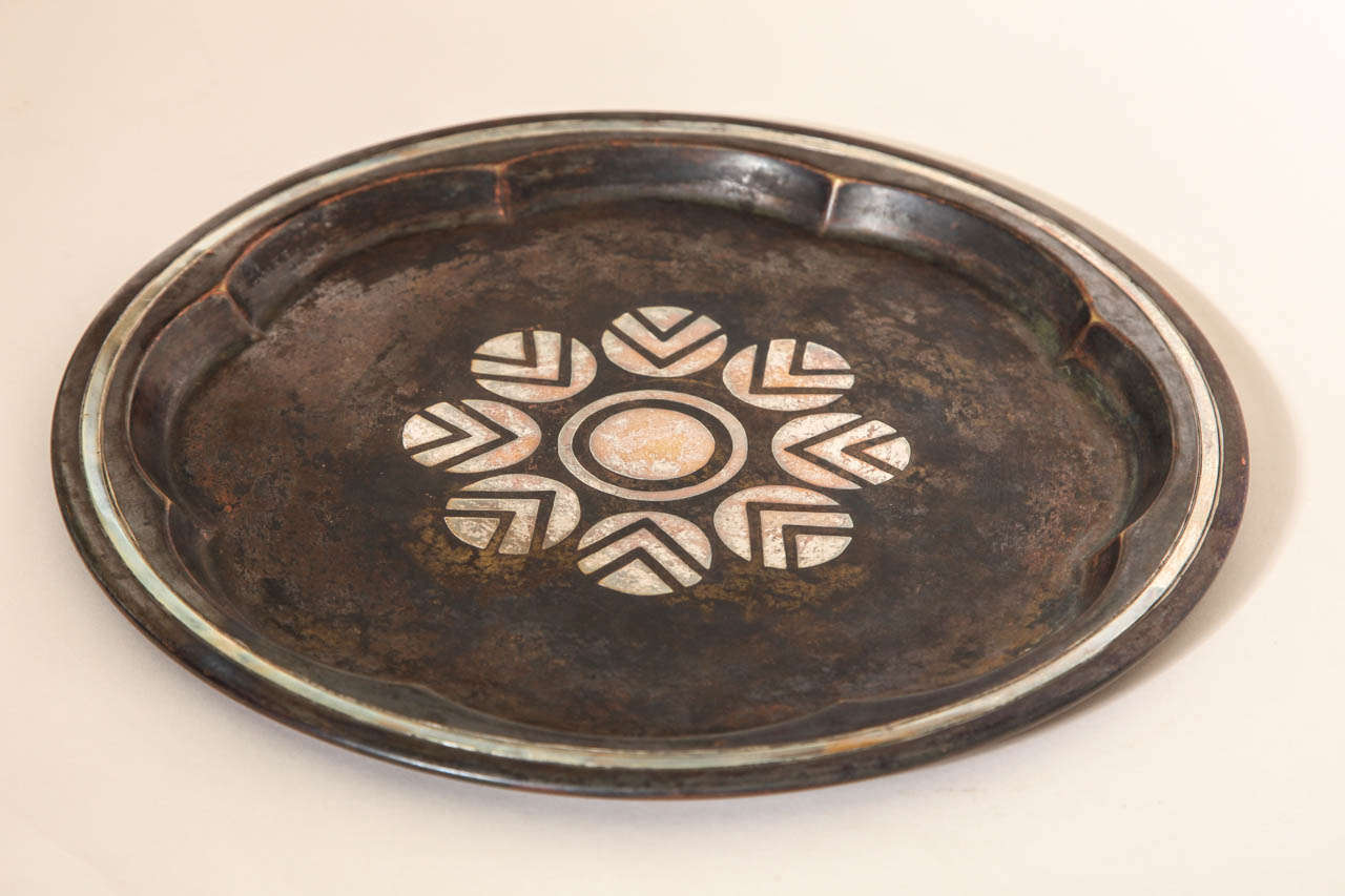 Copper tray with scalloped interior rim and geometric pattern of circles centrally.
Hallmarks:  Christofle B 127 I

*Variety of other dinanderie pieces available.