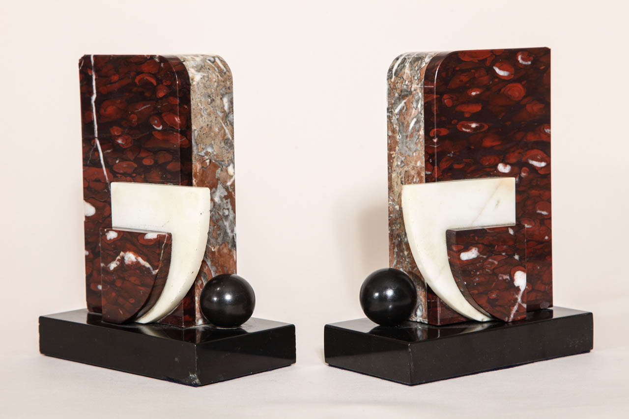 Geometric marble design in red and white marble with black patinated metal sphere on black marble base

Provenance
Collection du Chateau de Gourdon.