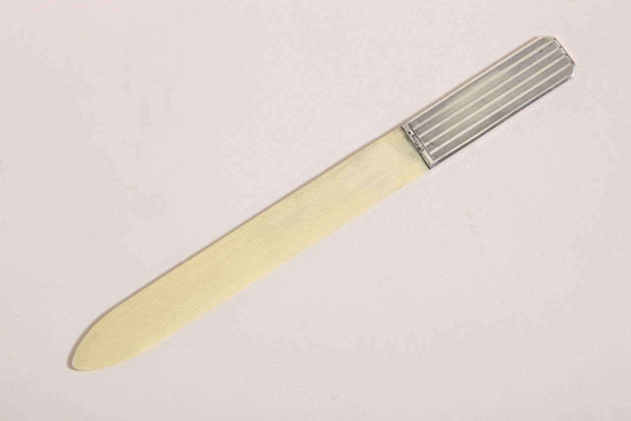 With silver handle with vertical linear pattern.
Hallmarks:  for 800 German silver/ maker’s mark