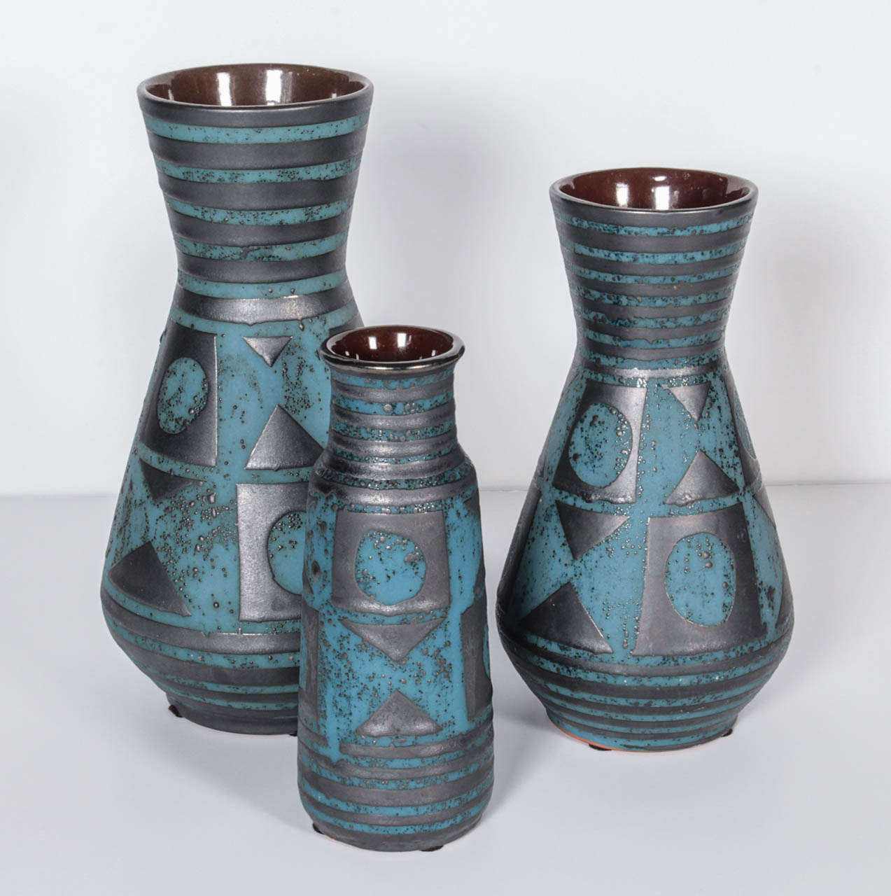 Trio of 3 German ceramic vases. Blue glaze with black metallic finish. Marked. Can be purchased individually.
Left: 6.25