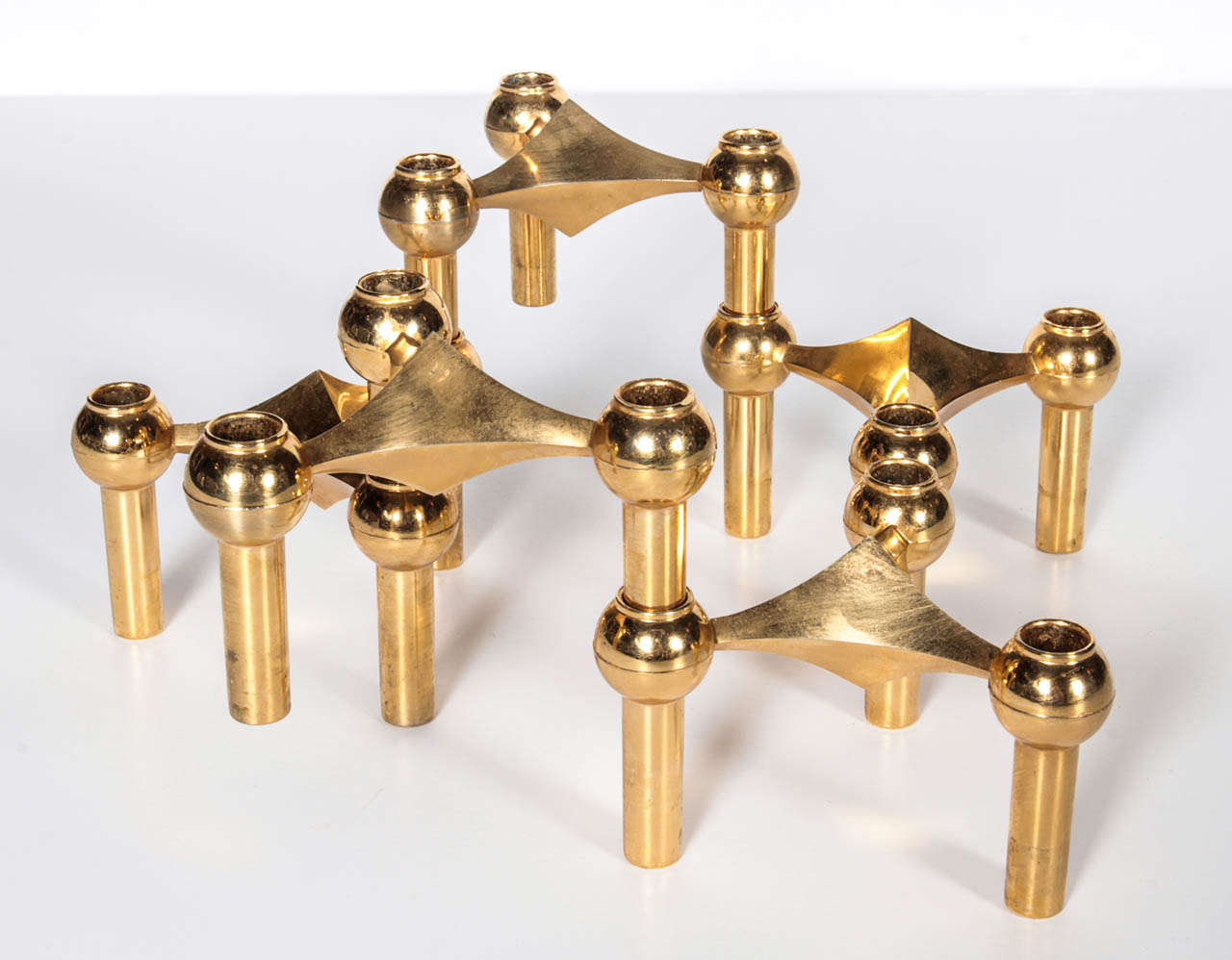 Modular gold-plated candelabrae signed by Cesar Stoffi for Nagel Germany. Each individual candle holder is 4