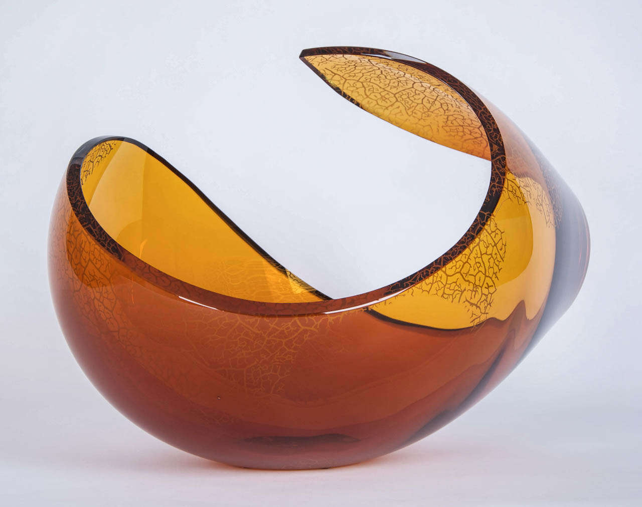 Free-form blown sculptural glass bowl by Lena Bergstrom. Amber/gold glass with engraved surface pattern. Unique piece.