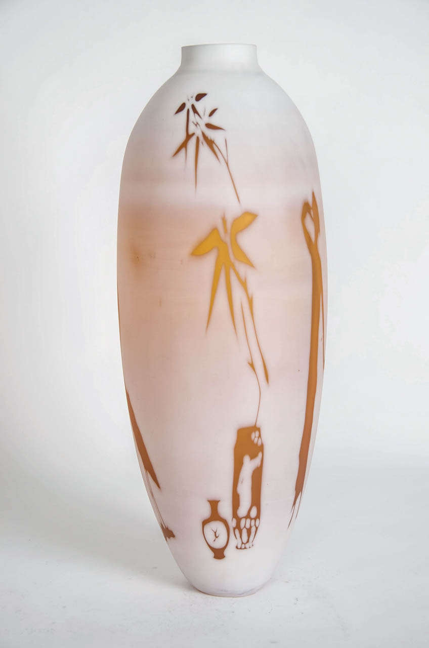 Dorchester Cameo Vase, is a unique amber with white overlay vase by the British artist Sarah Wiberly. This collection is inspired by the traditions of English 19th century cameo glass. The imagery follows the familiar motifs of floral and bamboo