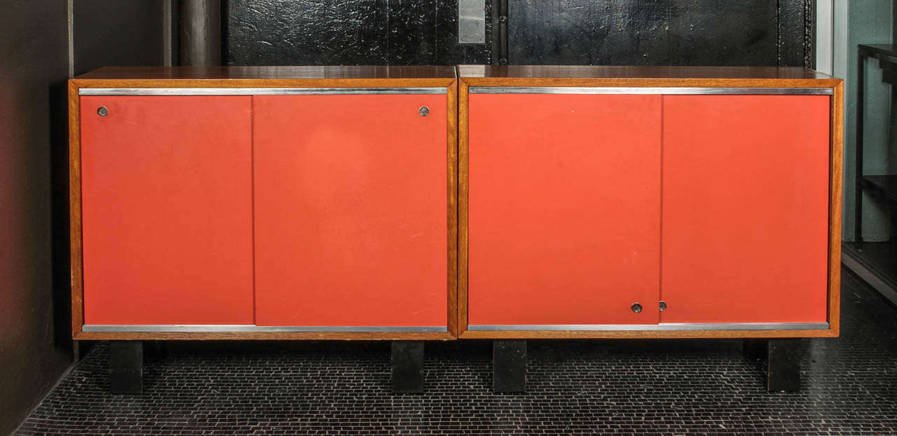 George Nelson primavera bookcase with original red sliding doors.   One is sold and the other remains available.  Price is for one and it comes with one shelf.