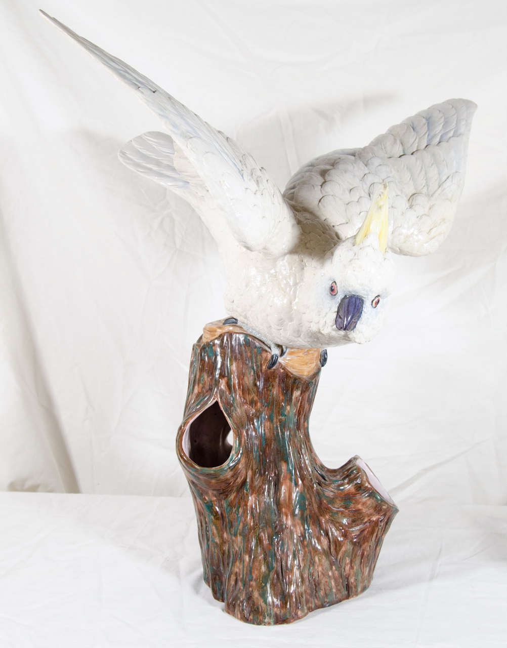 We are pleased to offer this large antique porcelain sculpture of a cockatoo made by Royal Worcester Porcelain in the last quarter of the 19th century. The sculpture is the size of a live cockatoo. Modeled as if it is about to take flight, the bird