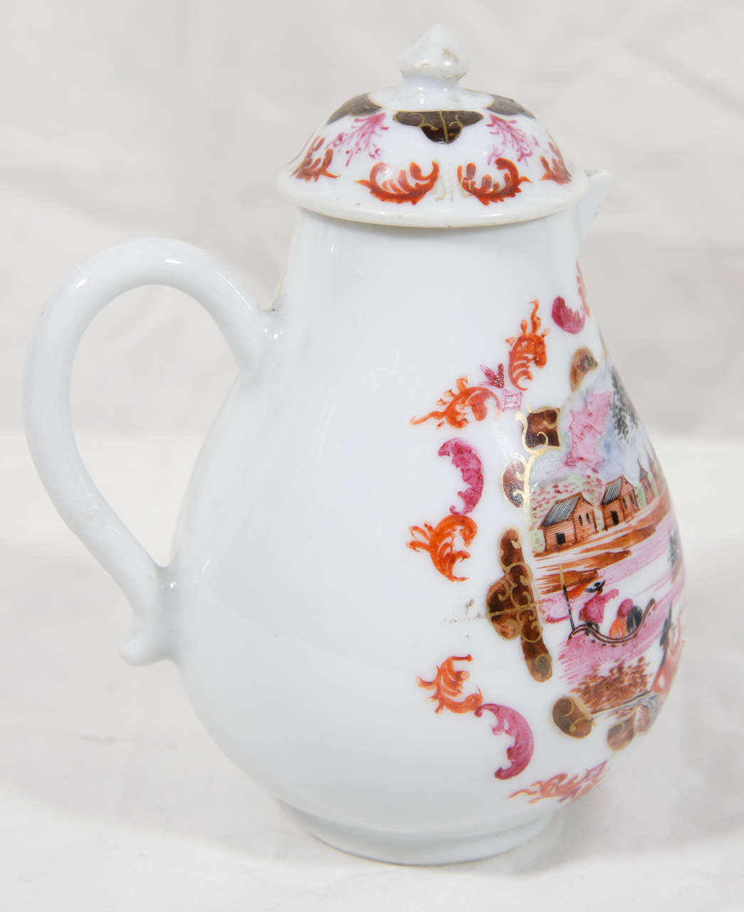 A fine Chinese export sparrow beak jug decorated in Holland in the 18th century soon after the porcelain was imported from China. The naive decoration shows two men in conversation at the water's edge one seated and smoking a pipe, on the water a