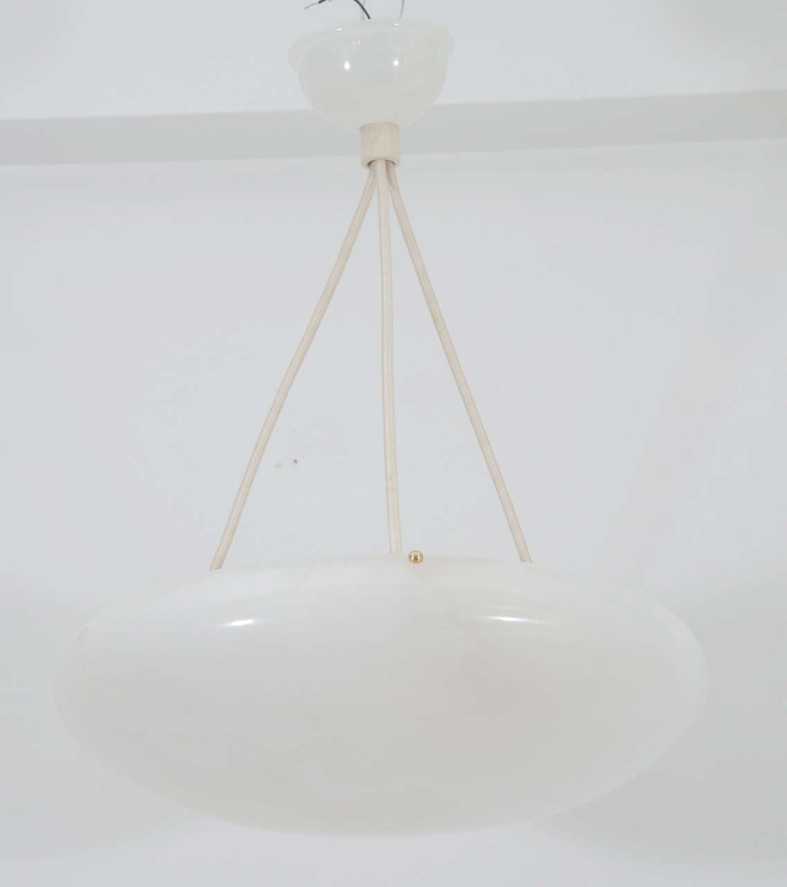 Pure white and radiant, this oblate spheroid is suspended on a set of three electrified ropes, holding three 60 watt bulbs, or LED equivalents.

Custom rewiring to your specified drop is included in purchase price.

Available to view in our