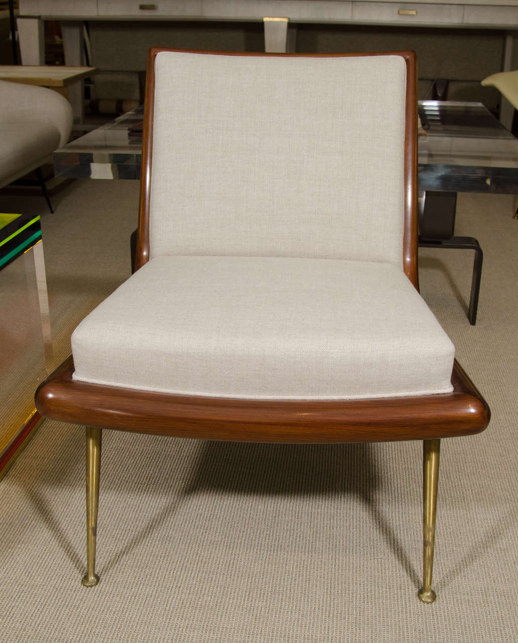 A pair of T. H. Robsjohn Gibbings for Widdicomb upholstered slipper chairs with slender brass tapering legs. Model No: 1740, circa 1950.