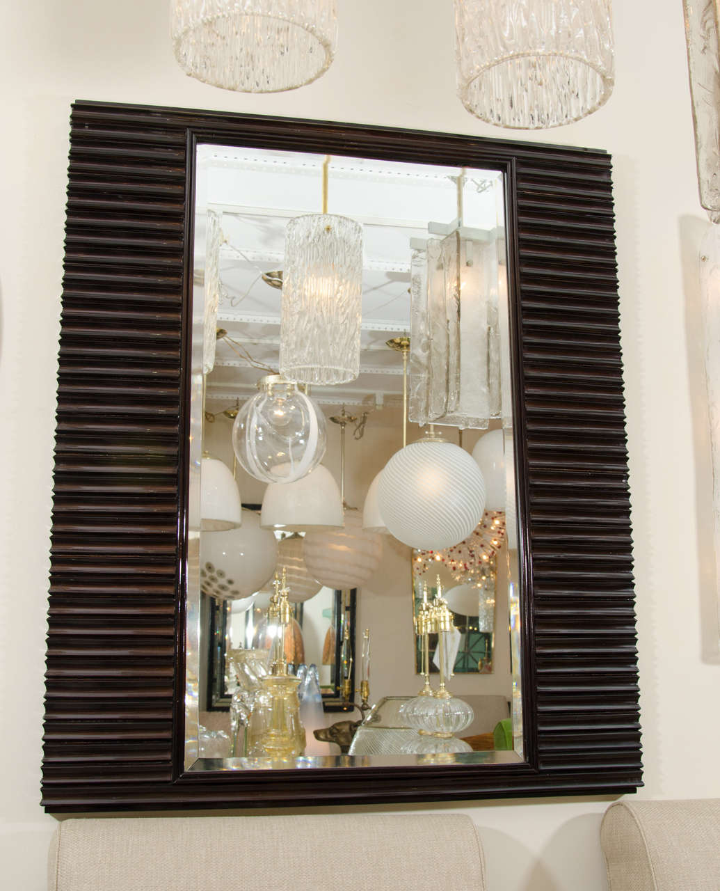 Rectangular mirror with ridged lacquered wood surround attributed to Osvaldo Borsani.