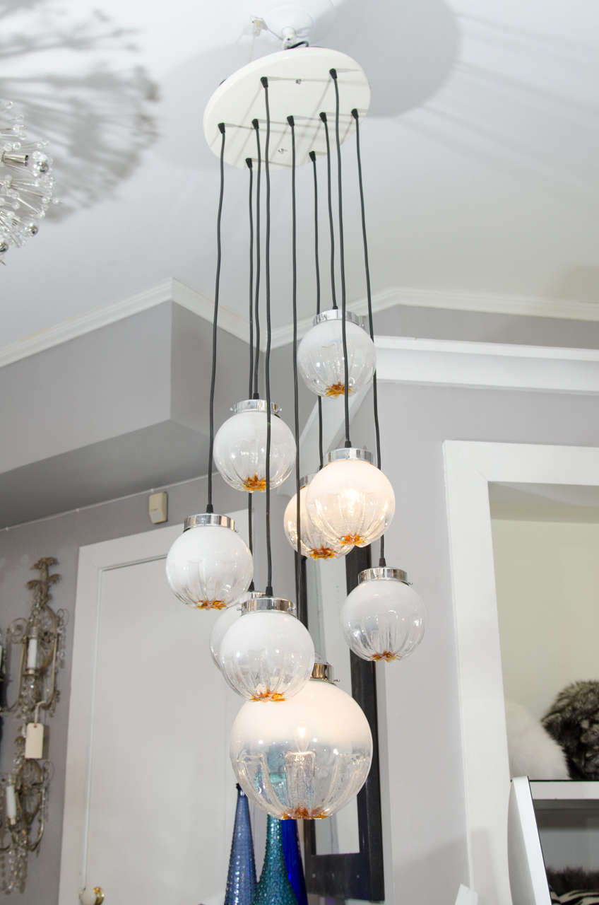 1970s Mazzega pendant chandelier with nine opaline and amber globes.