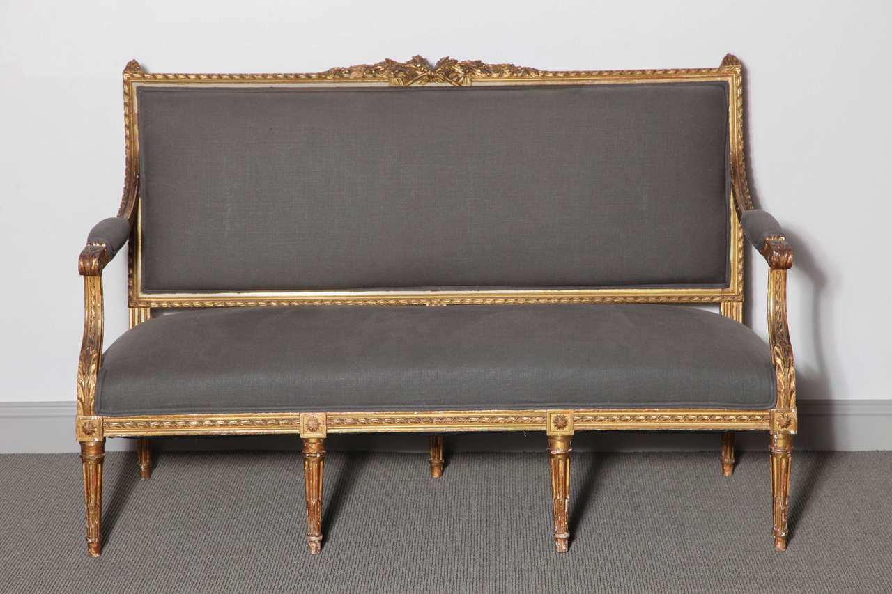 A finely carved and gilded Louis XVI style canapé.