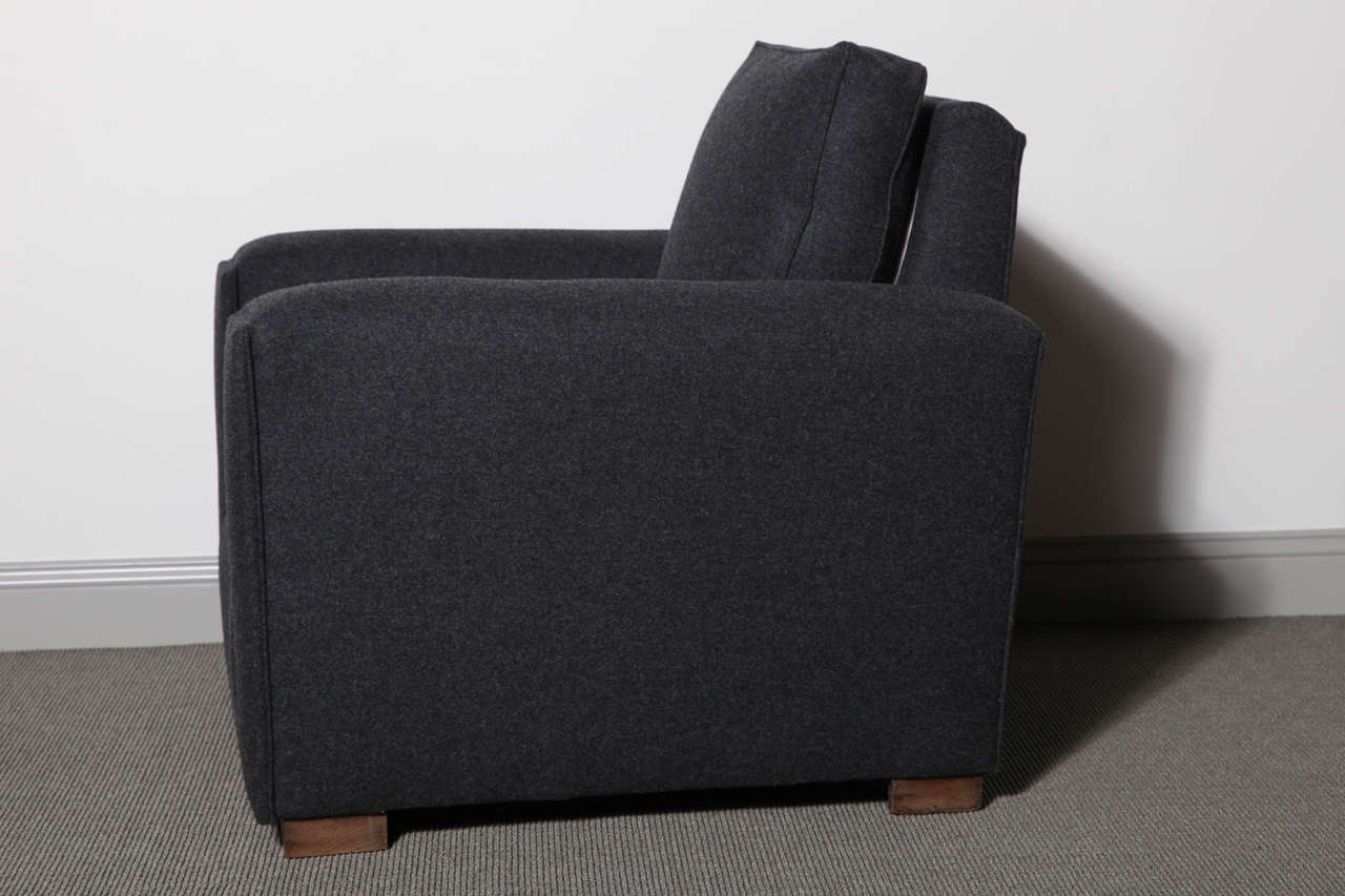 Armchairs fully upholstered in charcoal felt.