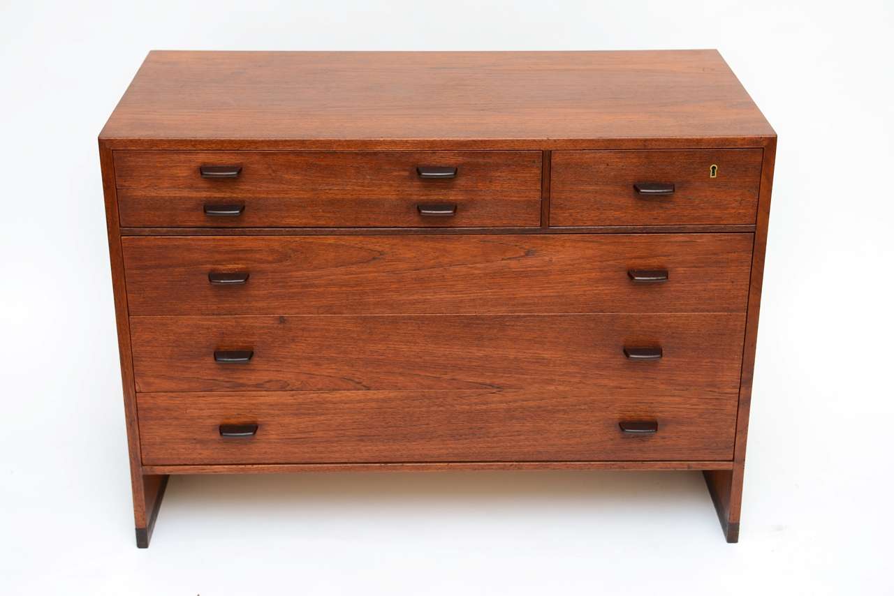 REDUCED FROM $4,250....Imported by George Tanier, this wonderfully warm patina teak dresser or small server by Hans Wegner for Ry Mobler is exceptional. First the beautiful teak figuring and the patina. The design is quite functional with three deep