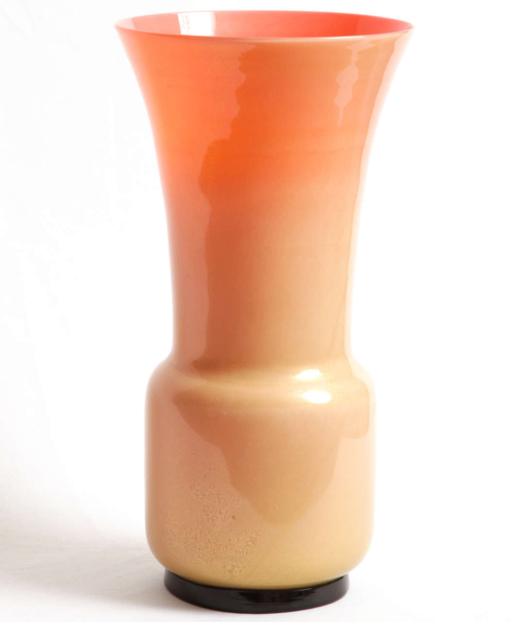 A tall 'Laguna' vase designed by the Italian architect Tomaso Buzzi (1900-1981) and executed by Venini, glassworks in Murano,Italy. Model created circa 1933.
'Peach/pink' colour glass with gold foil and applied solid glass foot.
Engraved signature