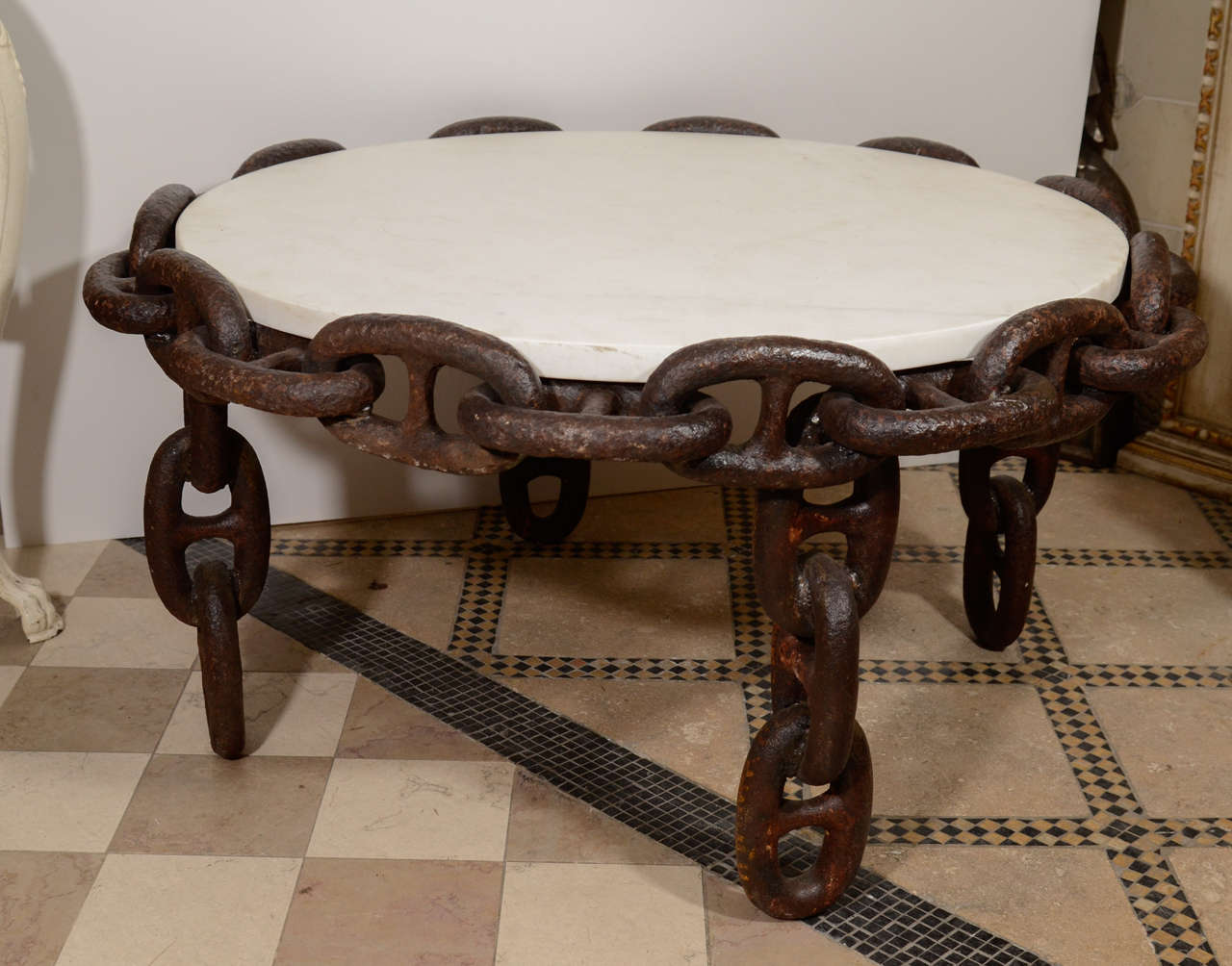 This beautiful round chain table made by Olde Good Things was featured on the front cover of House Beautiful magazine, July/August 2012. Made from salvaged anchor chain. The top is marble that was salvaged from the lobby of a downtown New York City