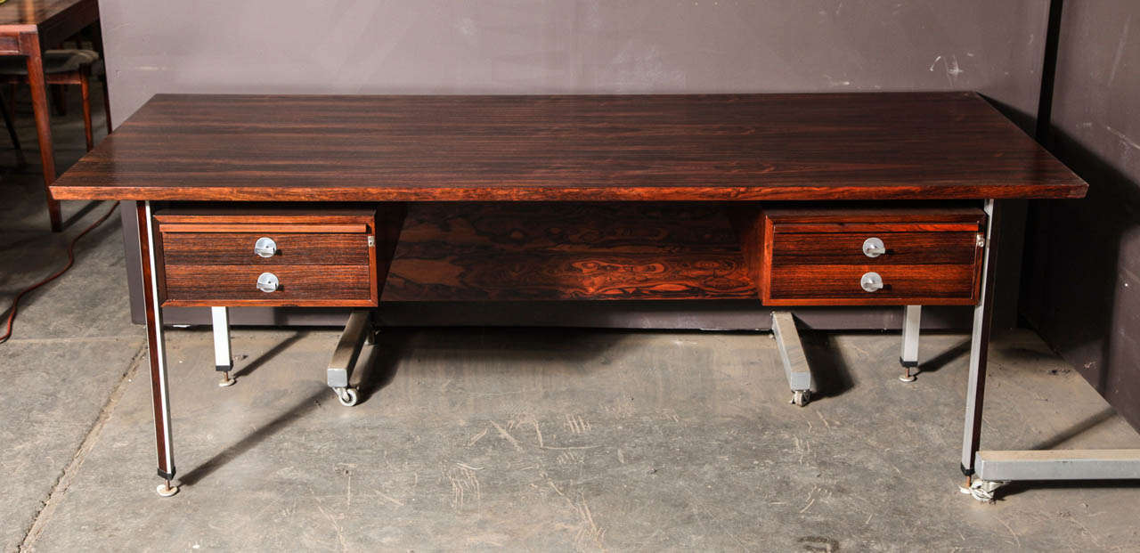 Vintage 1960s Technocrat Desk by Finn Juhl.

A stunning executive desk made from rosewood, Aluminium , steel and chrome. This desk is large and impressive.