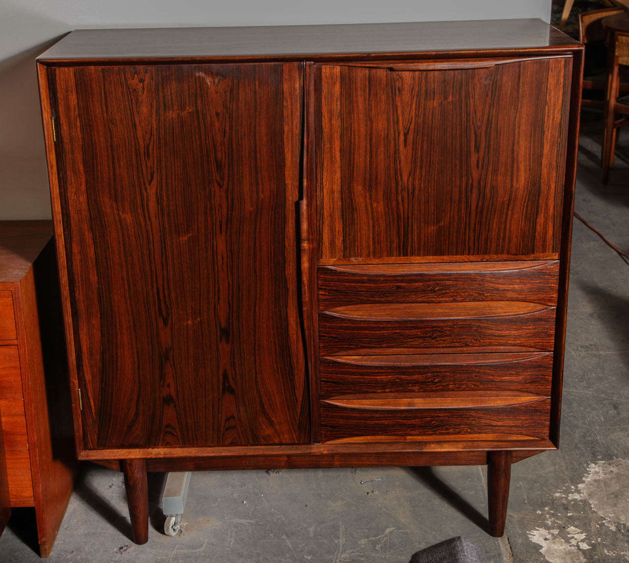 Vintage 1960s Rosewood Gentlemans Chest by Omann Jun.

This Vintage Wardrobe is in like-new condition. The four drawers, shelves and drop down section is there to help you organize your clothing storage needs. The rosewood here is an excellent