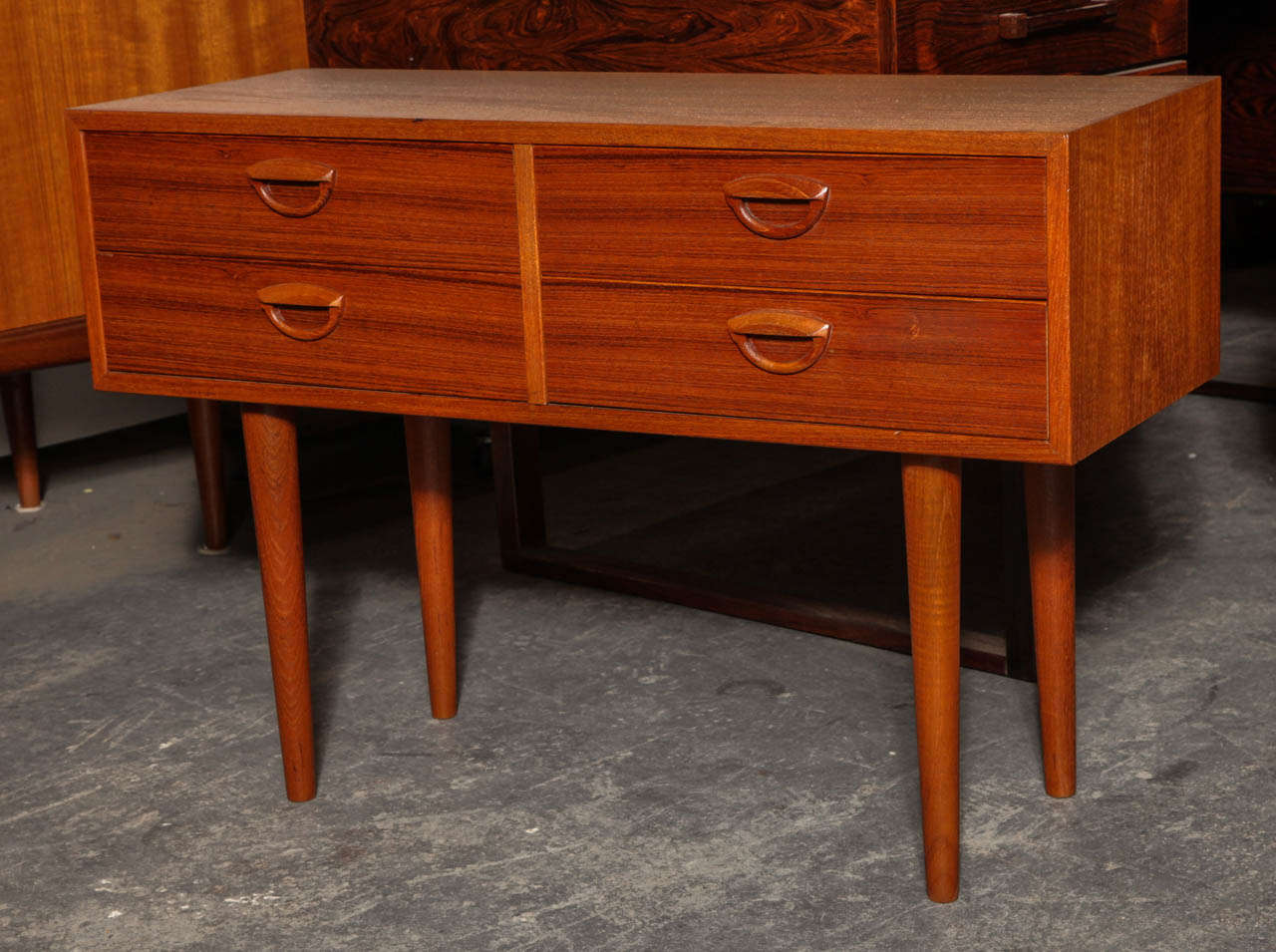 Vintage 1960s Kai Kristiansen Nightstands

A wonderful pair of Teak Bedside Tables by Kai Kristiansen. Each nightstand has 4 drawers and conical legs.  Can also serve as side tables in another part of the house and can handle a small TV. Ready for