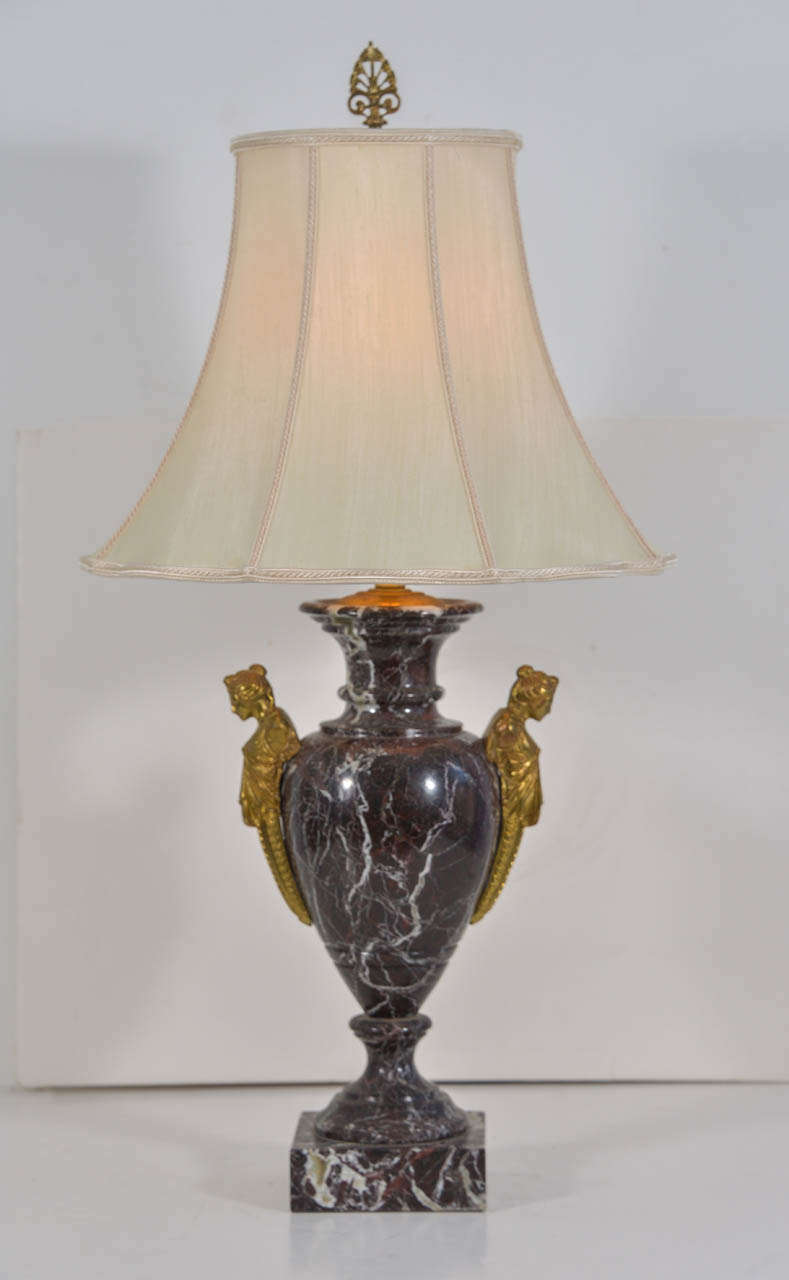 Polished French marble urns with bronze maiden busts as handles wired as table lamps. Shades shown, 16