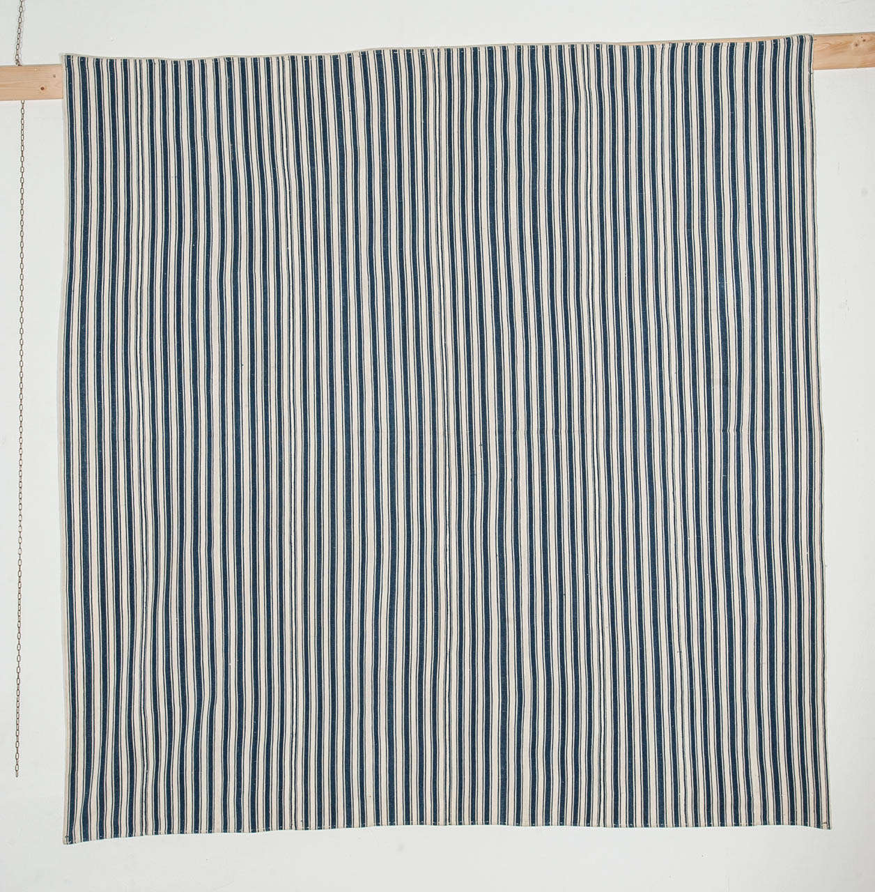 An ivory and indigo flat-weave, composed of various panels hand-sewn together, woven in the weft-substitution technique also known as Jajim. These flat-weaves were used in the tents of the Kurdish nomadic tribes inhabiting the mountainous regions of