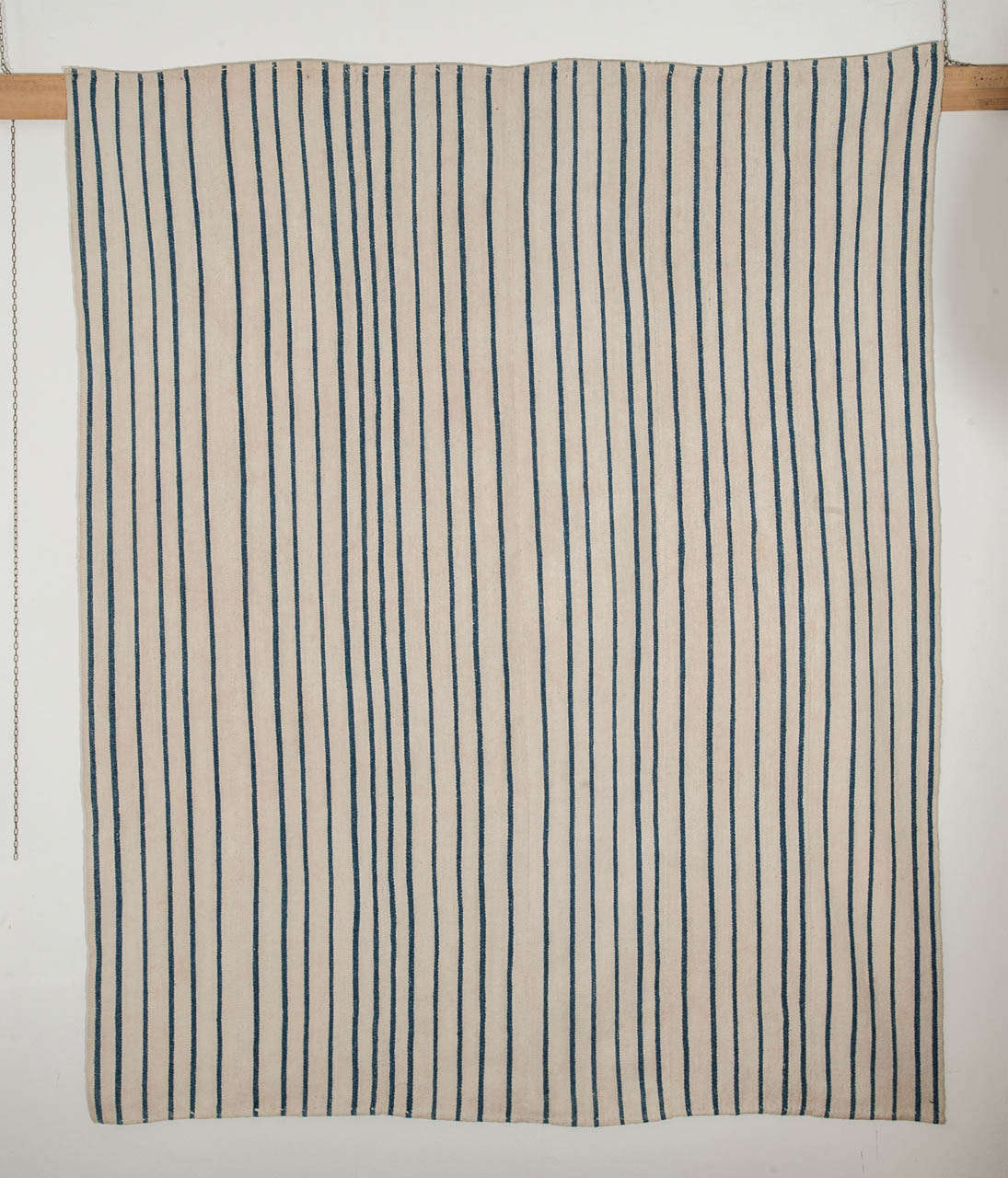 An ivory and indigo flat-weave, composed of various panels hand-sewn together, woven in the weft-substitution technique, also known as Jajim. These flatweaves were used in the tents of the Kurdish nomadic tribes inhabiting the mountainous regions of