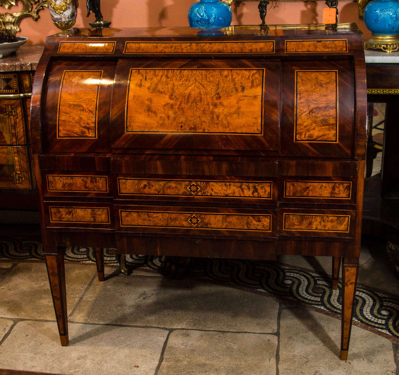 An unusual Dutch Neo Classic walnut inlaid cross banded roll top desk with a fitted interior and sliding writing surface.