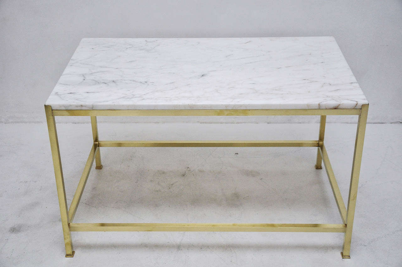 Brass frame coffee table with marble top by Harvey Probber.