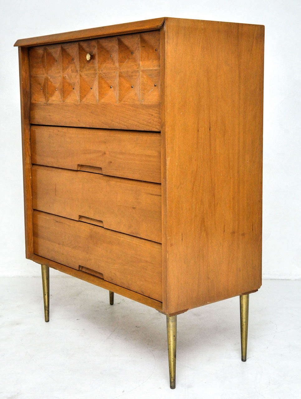 Birch highboy by  Salvatore Bevelacqua for Alliance Furniture, circa 1954. Sculpted front drop down door with brass details and legs.

**Matching sideboard available.