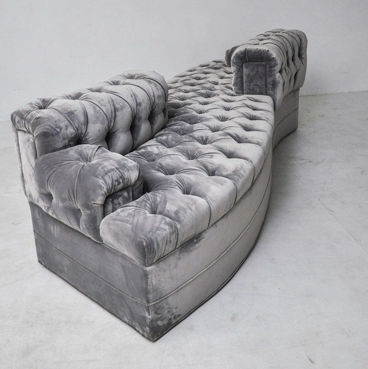 Tufted conversation sofa.  Fully restored and reupholstered in grey silk viscose velvet.