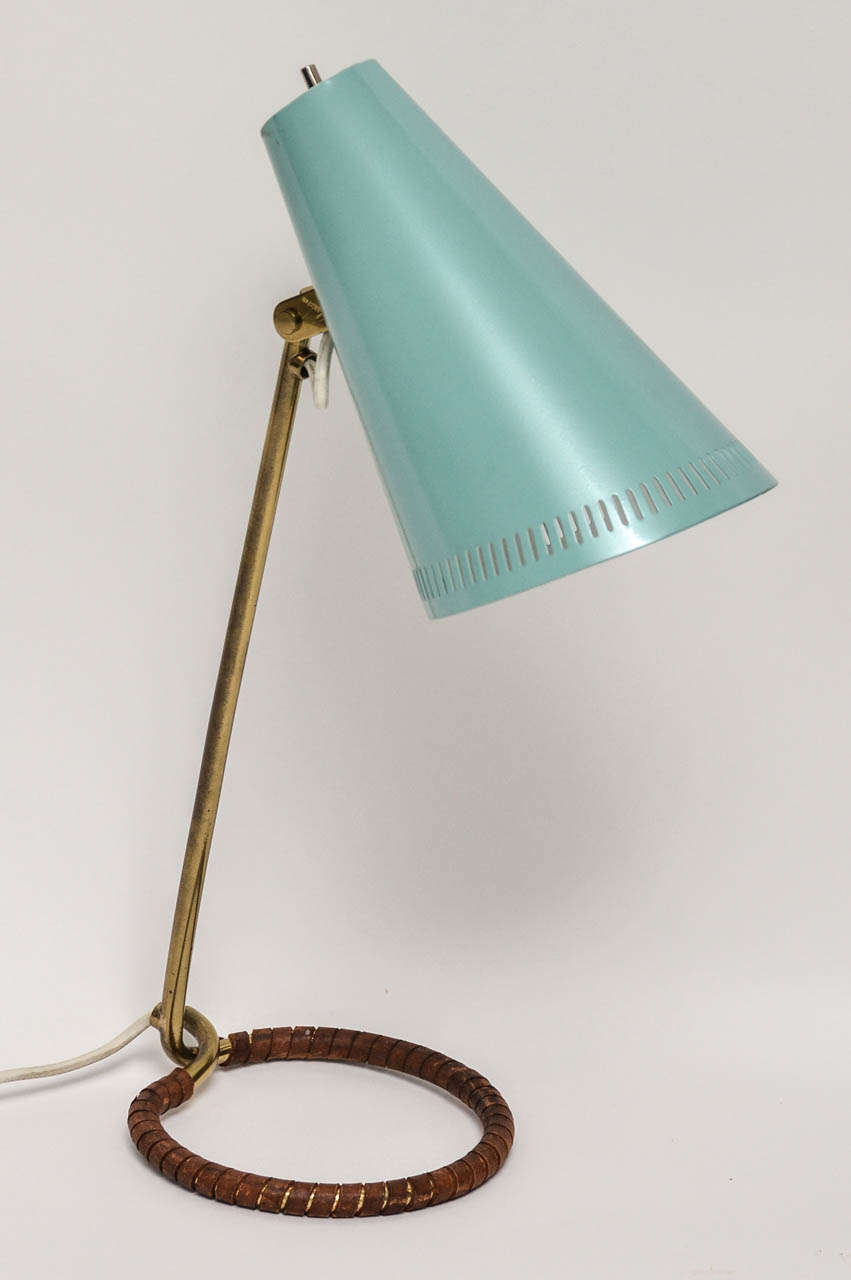 Stylish Pair of Idman Lamps designed by Mauri Almari with integral open Base and Shaft.  Brass Pivot mechanism attached to Turquoise-hued metal Helmet
Shade (with pierced slits).