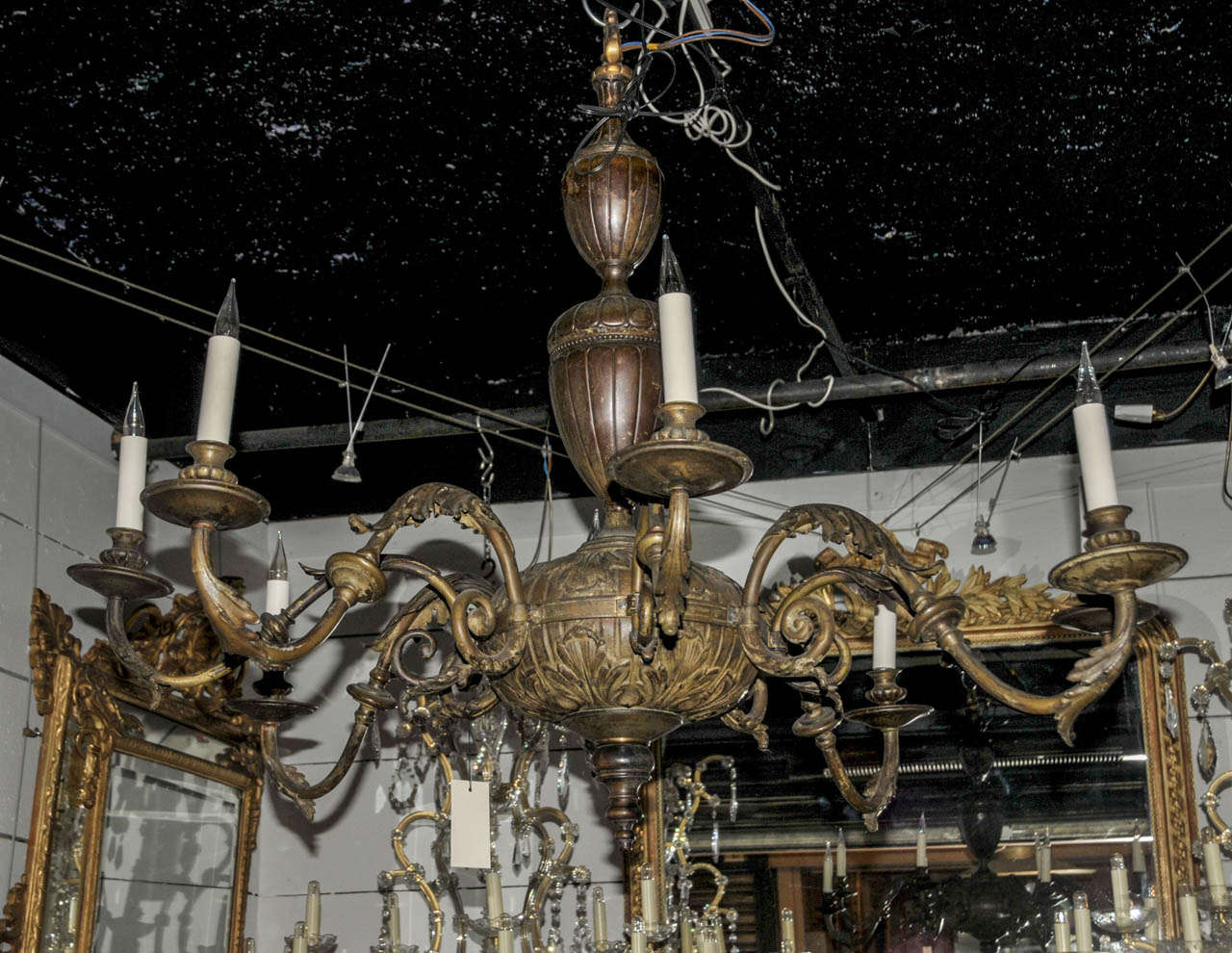 Large 1880 patinated iron chandelier with eight lighted arm. Not wired. Good condition. Normal wear consistent with age and use.