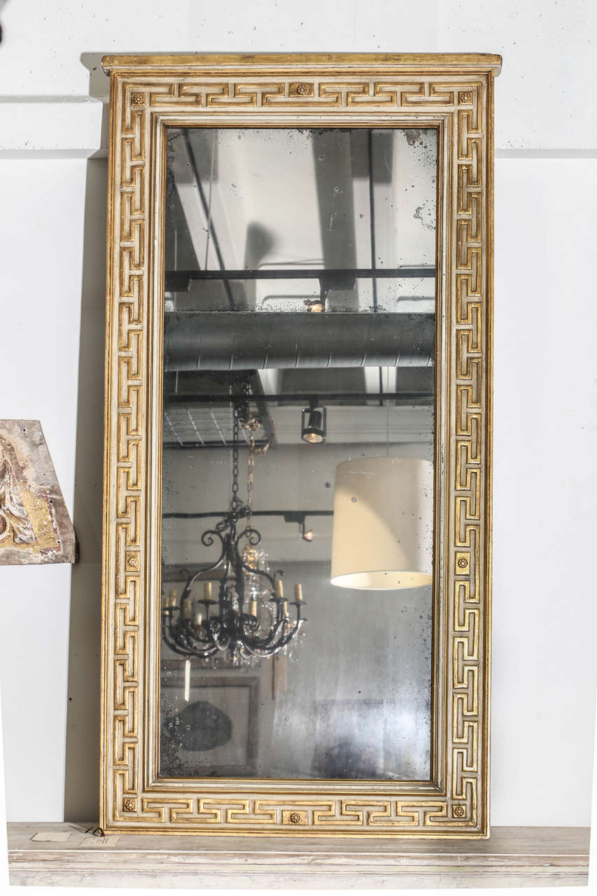 18th century neoclassic trumeau with original mercury glass and Greek key design.