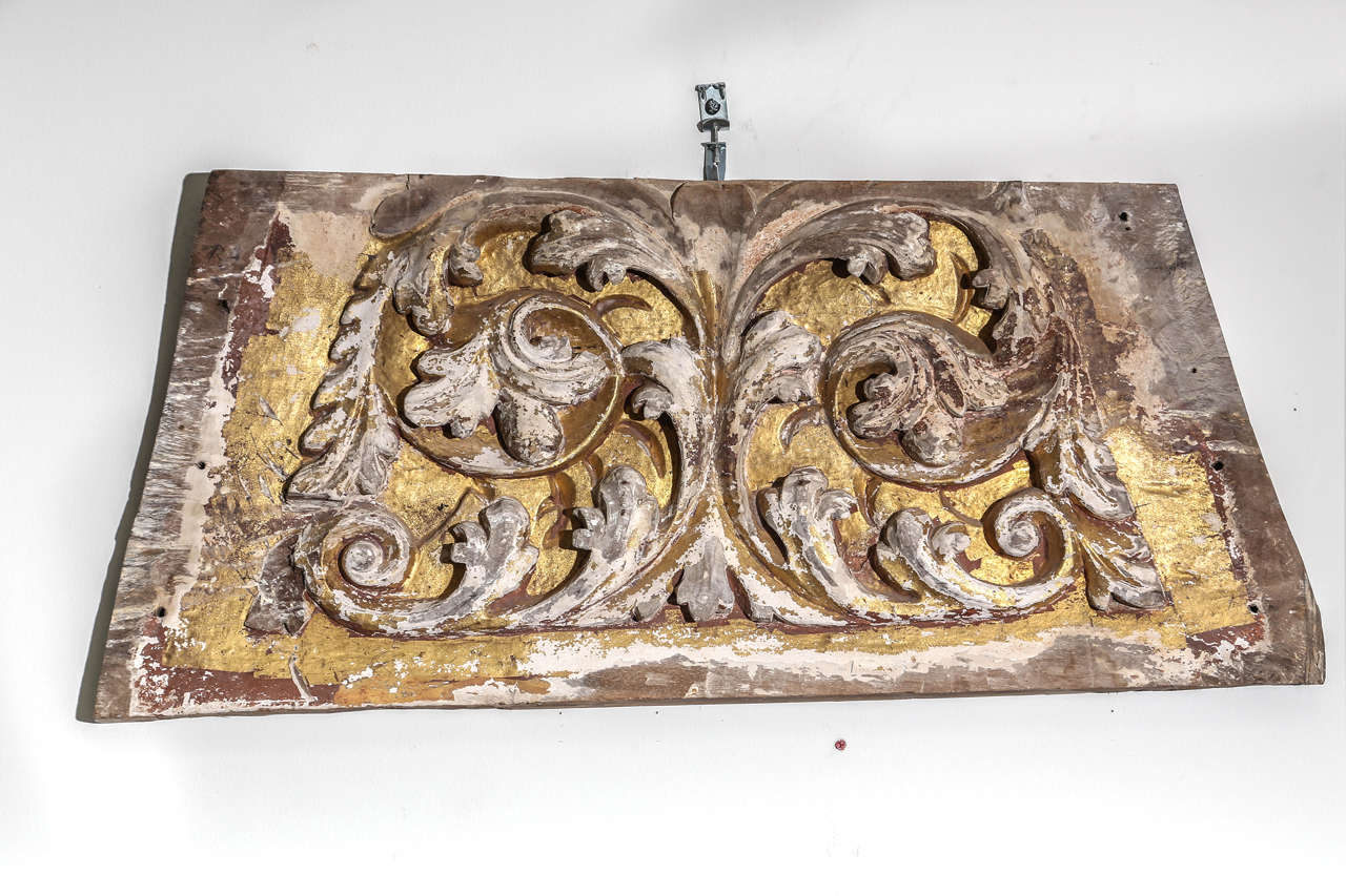 17th century Baroque carved wood fragment with traces of original gilt. Wonderful three-dimensional hand carving of swirls and leaves. Originally part of a trumeau embedded in the wall of a chateau.