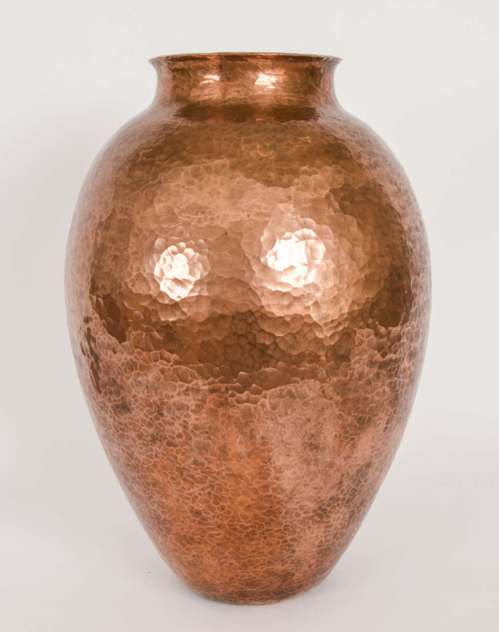 A mid 20th century hand beaten Parisian copper vase