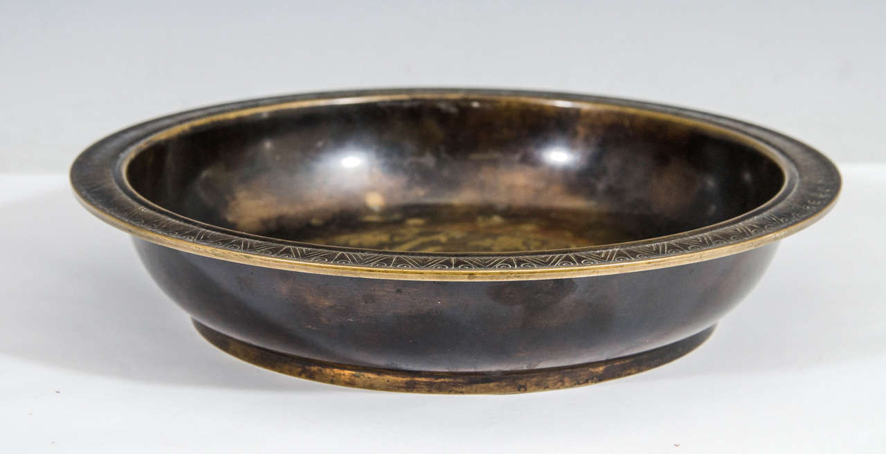A just Andersen decorative Disko bowl with deer and dove design.

Just Andersen (1884-1943) sculptor and silver smith. In his early carrier he was designing jewelry for A. Michelsen and P. Hertz. He continued a lifelong production of silver and