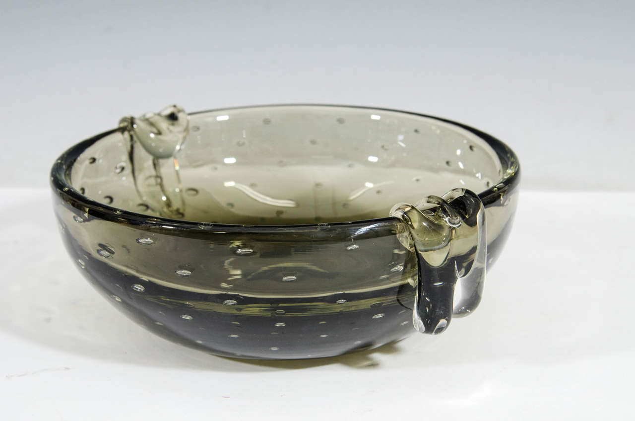 A vintage smokey gray 'bullicante' otherwise bubble glass bowl, produced circa 1950's-1960's by Swedish-born glass maker Carl Erickson. Good vintage condition, with age appropriate wear.