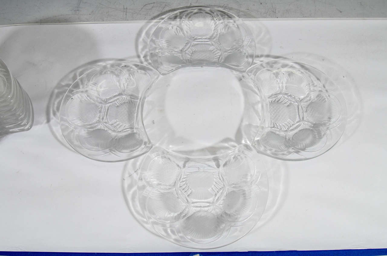 A vintage set of 12 crescent shaped crystal Chardon thistle dessert plates signed Lalique, France.