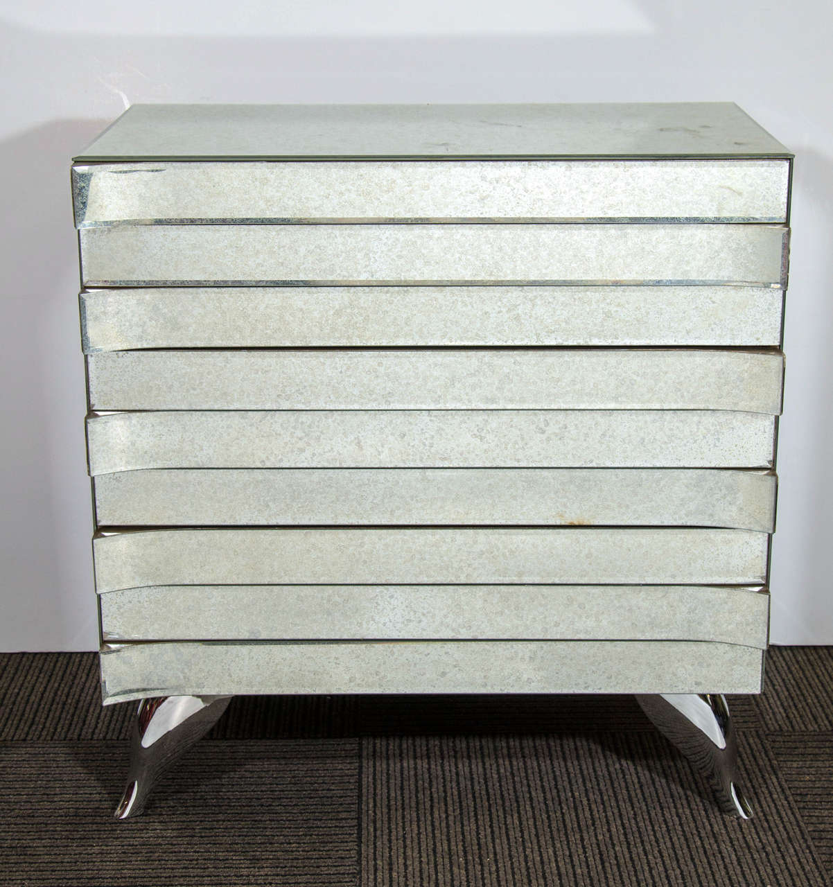 A pair of contemporary, custom-made commodes, with distressed mirrored panels, each with three drawers. Each commode is in very good condition.