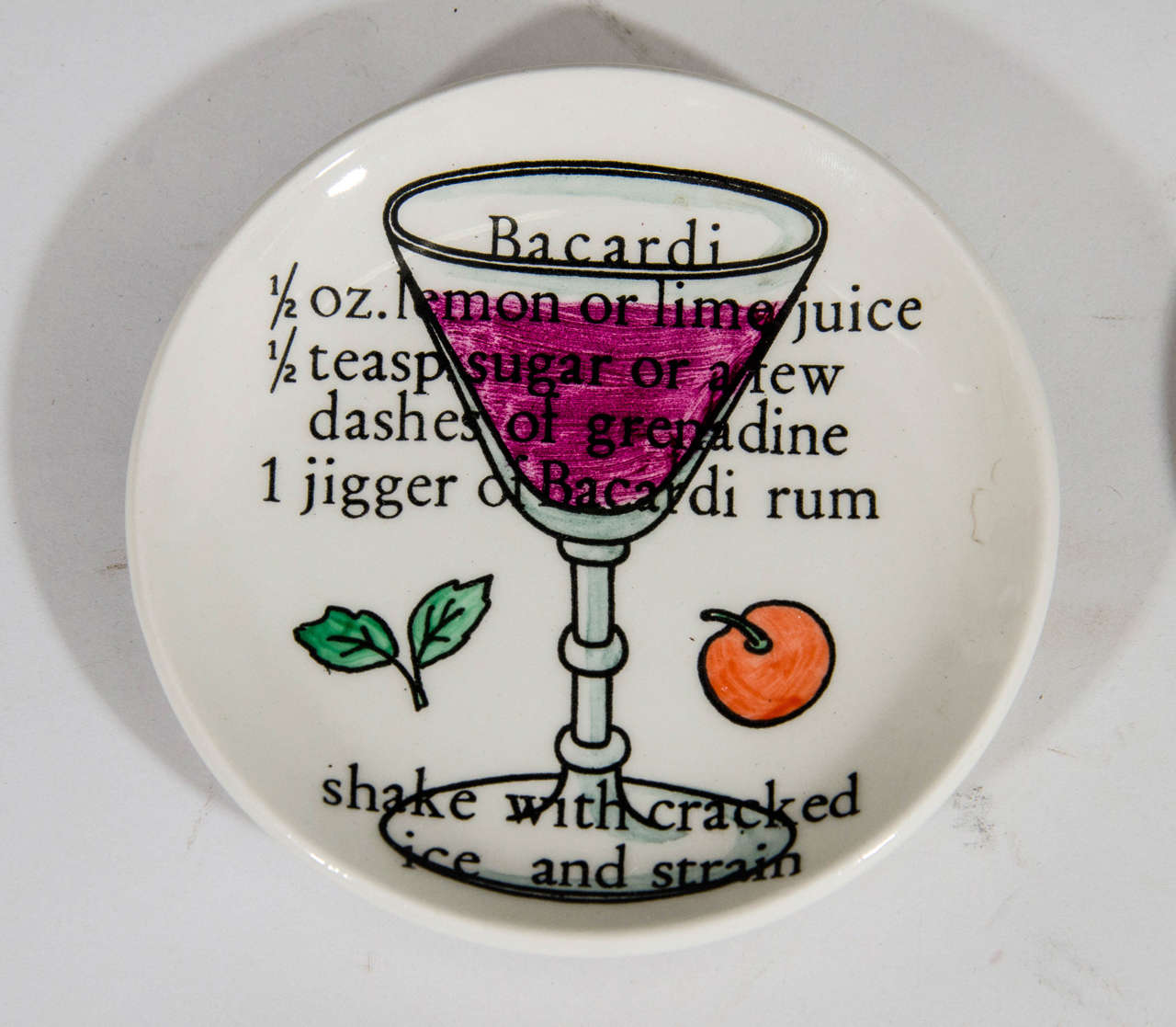 A vintage set of eight Piero Fornasetti coasters featuring cocktail recipes. Each coaster is stamped on the back with Fornasetti-Milano, made in Italy and logo of a cocktail Shaker being hand-painted. The original box measures 3.5