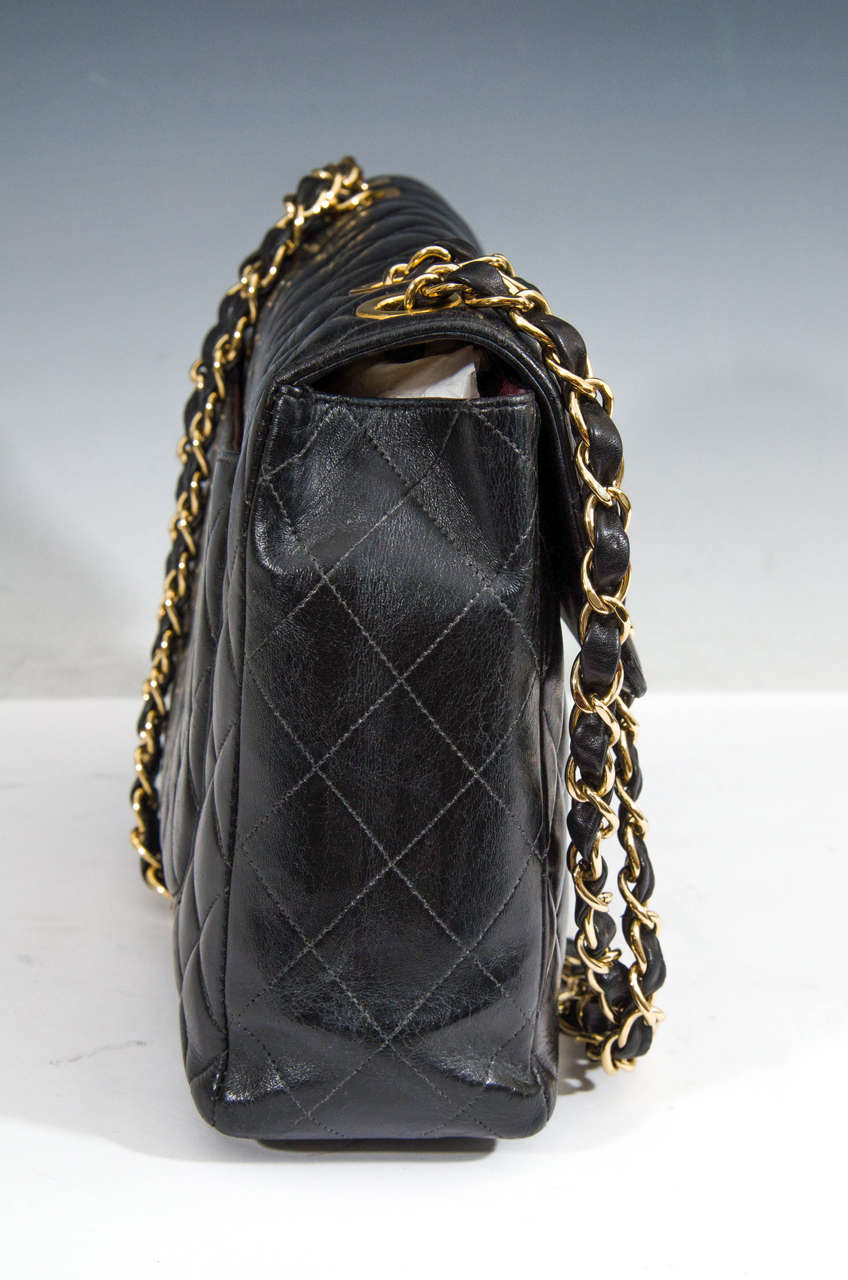 Authentic Chanel Black Classic Lambskin Maxi Handbag with Gold Tone Hardware 1