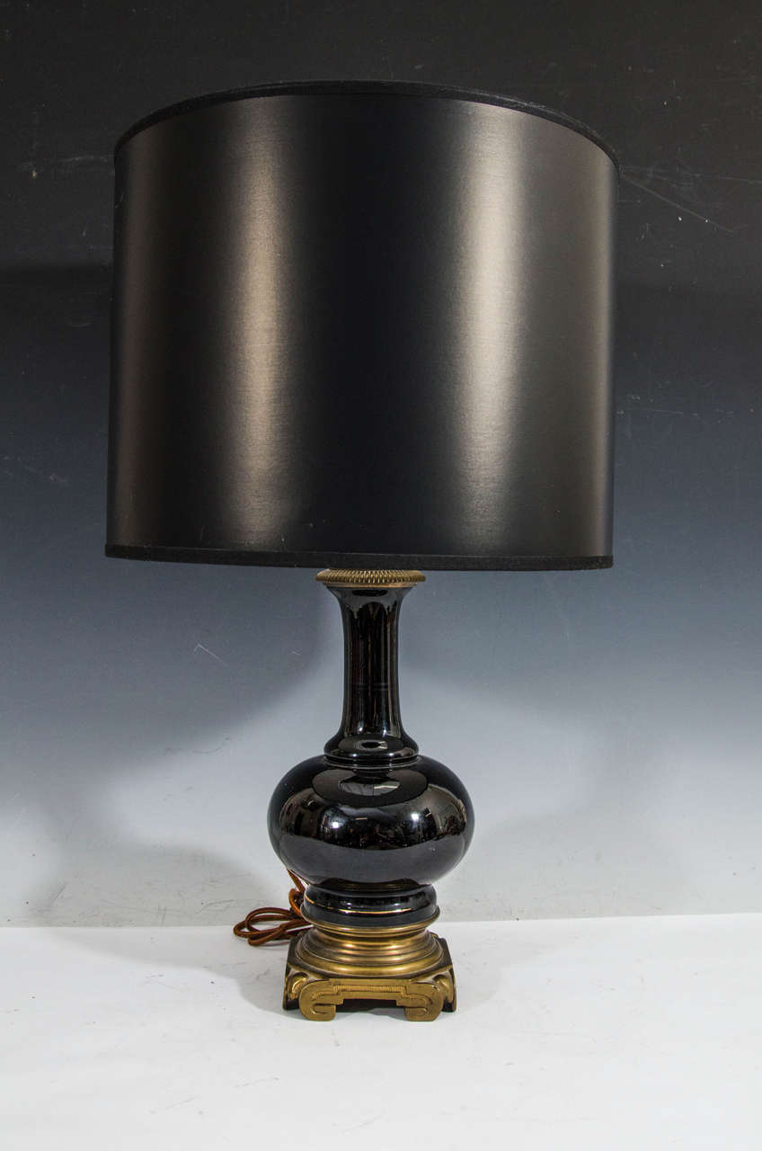 A pair of French black opaline glass table lamps with bronze bases. Dimension: 14 in. H to socket. Circa late 19th Century. 

Pair available here online. By request, pair can be made available by appointment to the Trade in New York.
