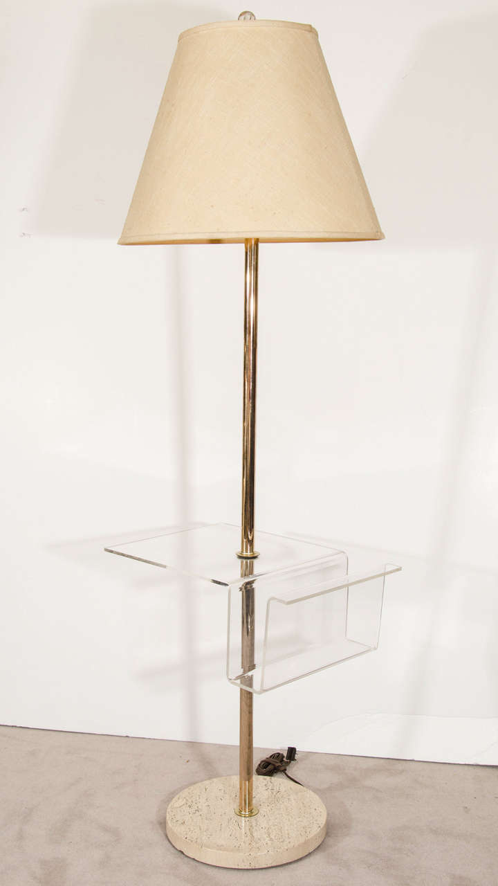 A vintage Italian brass floor lamp with Lucite magazine rack or table and stone base. Good vintage condition with age appropriate wear. Some scratches and chips to stone base. The plug is cracked and should be replaced.