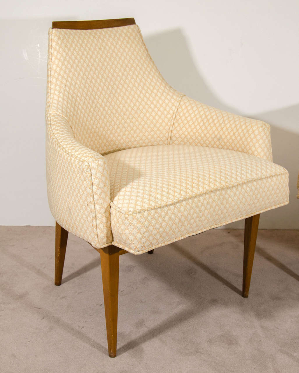 A vintage pair of lounge chairs in a cream color patterned upholstery by Paul McCobb for Calvin.

Reduced from: $1,250