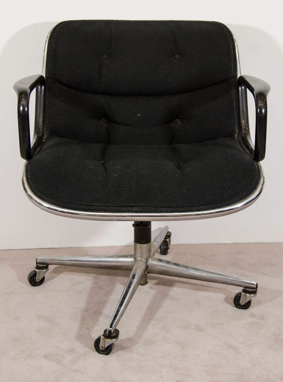 A vintage Charles Pollock for Knoll executive chair upholstered in a black knit fabric with four star base, and original Knoll Associates label under the seat. Good vintage condition with age appropriate wear and patina. Some pitting to the legs, a