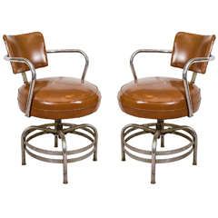 Mid-Century Pair of Chrome and Brown Vinyl Swivel Chairs