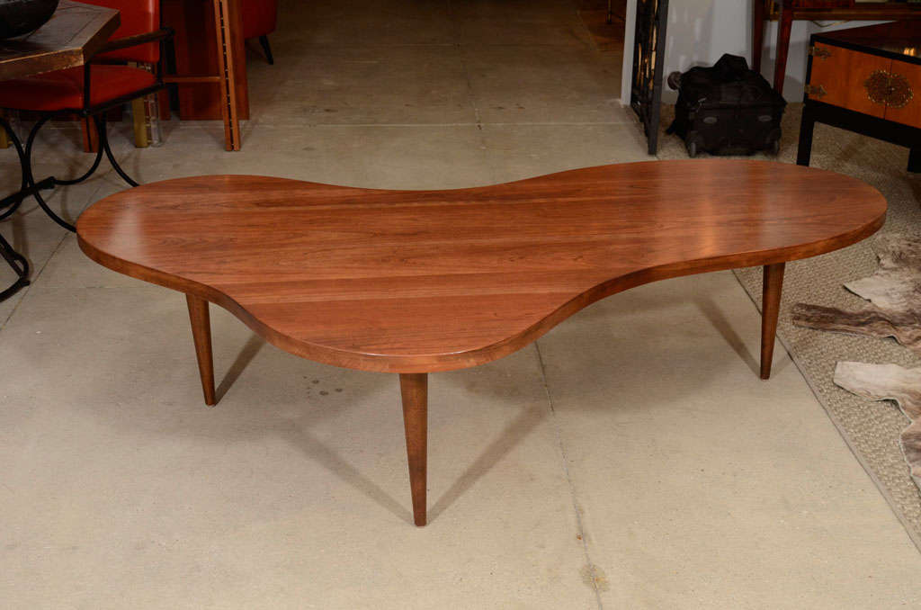 A cherry amoeba shaped coffee table designed by RH Gibbings for Widdicomb; Widdicomb label dated 2/1950.  A fabulous find!